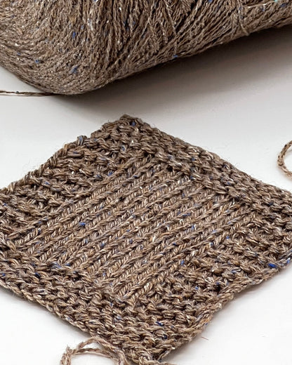 Exclusive iDOKNiT lace weight tweed yarn, PIGALLE by RiGo Italy. A complex luxury blend of 40% virgin wool, 20% silk, and 15% viscose, 750m/100g. Authentic Italian-made tweed with sophisticated multi-fiber texture and subtle silk sheen, curated by iDOKNiT for high-end, lightweight knitwear.