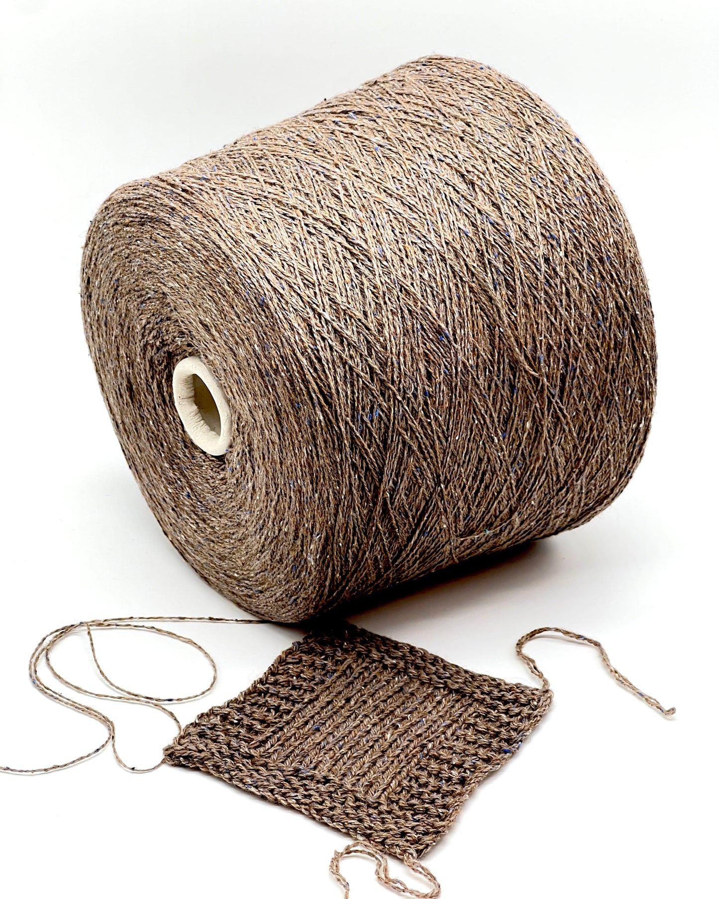 Exclusive iDOKNiT lace weight tweed yarn, PIGALLE by RiGo Italy. A complex luxury blend of 40% virgin wool, 20% silk, and 15% viscose, 750m/100g. Authentic Italian-made tweed with sophisticated multi-fiber texture and subtle silk sheen, curated by iDOKNiT for high-end, lightweight knitwear.