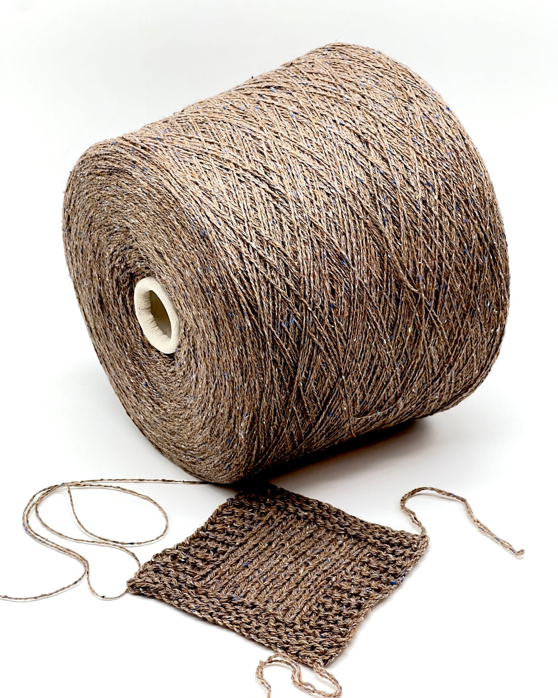 Exclusive iDOKNiT lace weight tweed yarn, PIGALLE by RiGo Italy. A complex luxury blend of 40% virgin wool, 20% silk, and 15% viscose, 750m/100g. Authentic Italian-made tweed with sophisticated multi-fiber texture and subtle silk sheen, curated by iDOKNiT for high-end, lightweight knitwear.