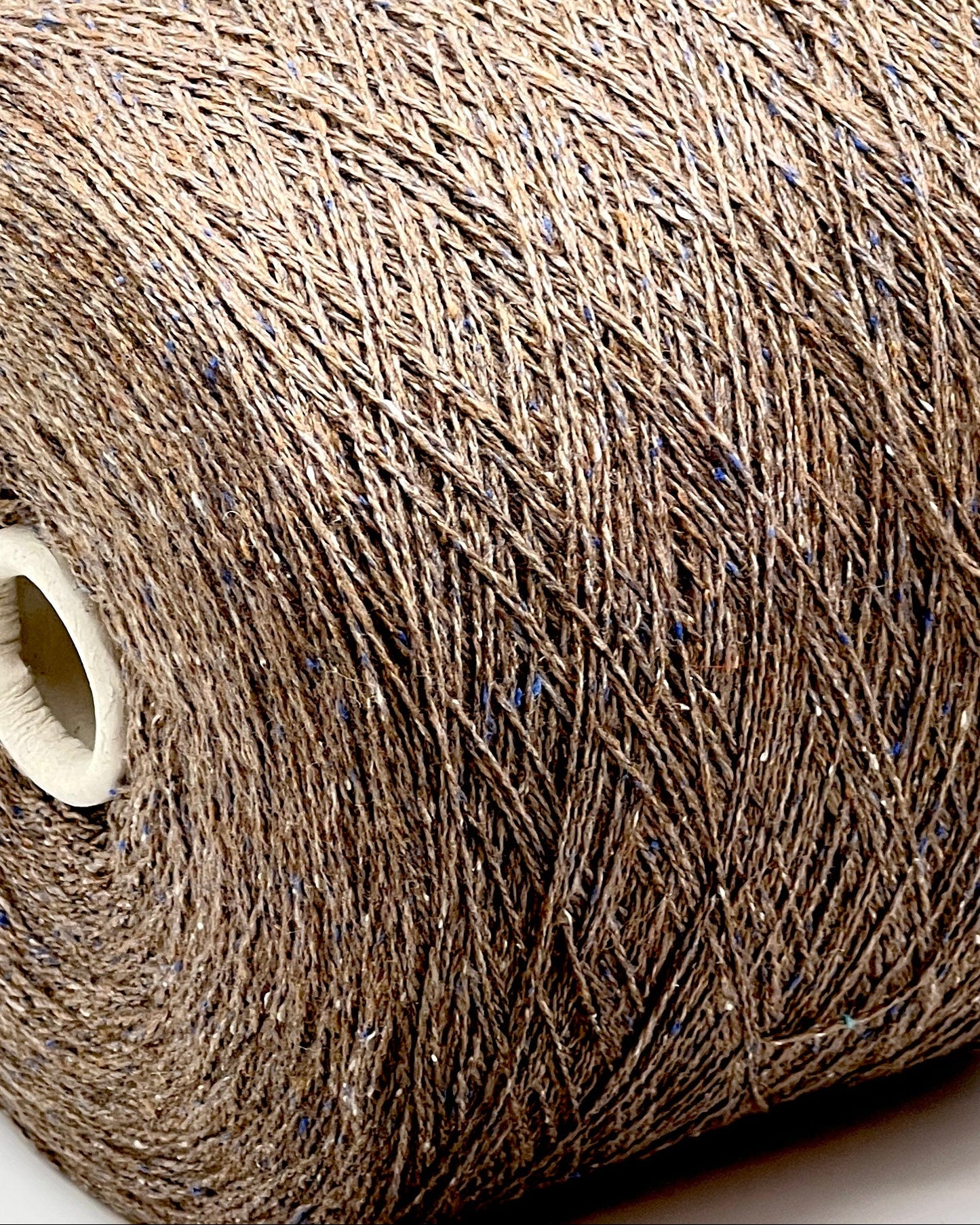 Exclusive iDOKNiT lace weight tweed yarn, PIGALLE by RiGo Italy. A complex luxury blend of 40% virgin wool, 20% silk, and 15% viscose, 750m/100g. Authentic Italian-made tweed with sophisticated multi-fiber texture and subtle silk sheen, curated by iDOKNiT for high-end, lightweight knitwear.