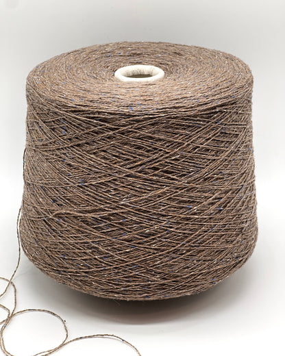 Luxury iDOKNiT lace weight tweed yarn, PIGALLE by RiGo Italy. Sophisticated blend of 40% virgin wool and 20% silk, 750m/100g. Authentic Italian-made tweed featuring a cocoa base with blue and cream flecks, curated by iDOKNiT for elegant, multi-textured garments with a soft silk finish.