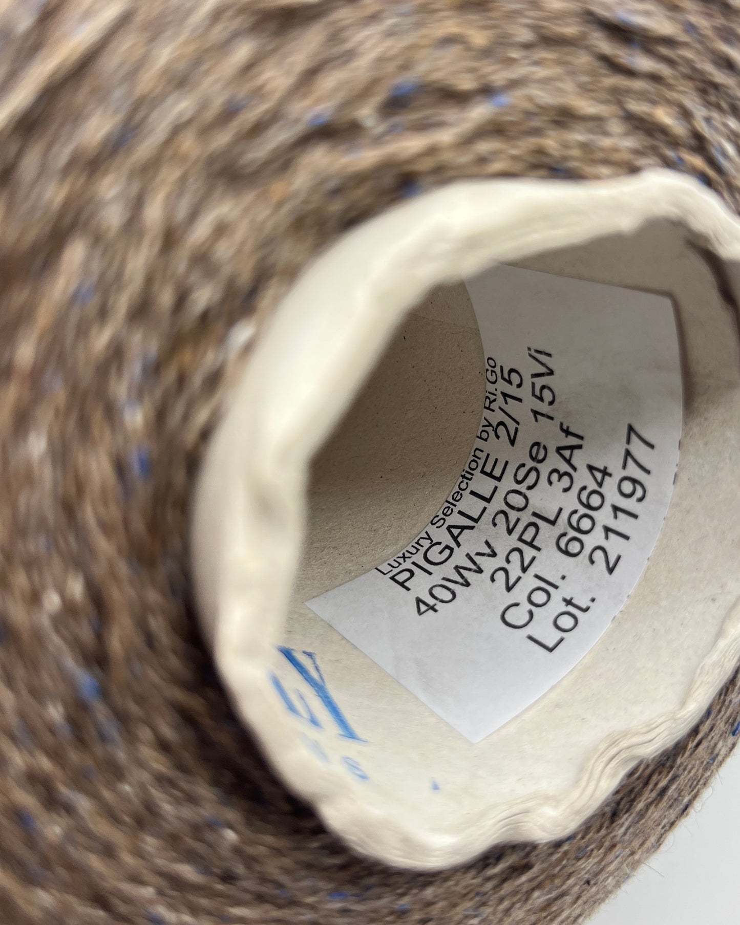 Exclusive iDOKNiT lace weight tweed yarn, PIGALLE by RiGo Italy. A complex luxury blend of 40% virgin wool, 20% silk, and 15% viscose, 750m/100g. Authentic Italian-made tweed with sophisticated multi-fiber texture and subtle silk sheen, curated by iDOKNiT for high-end, lightweight knitwear.