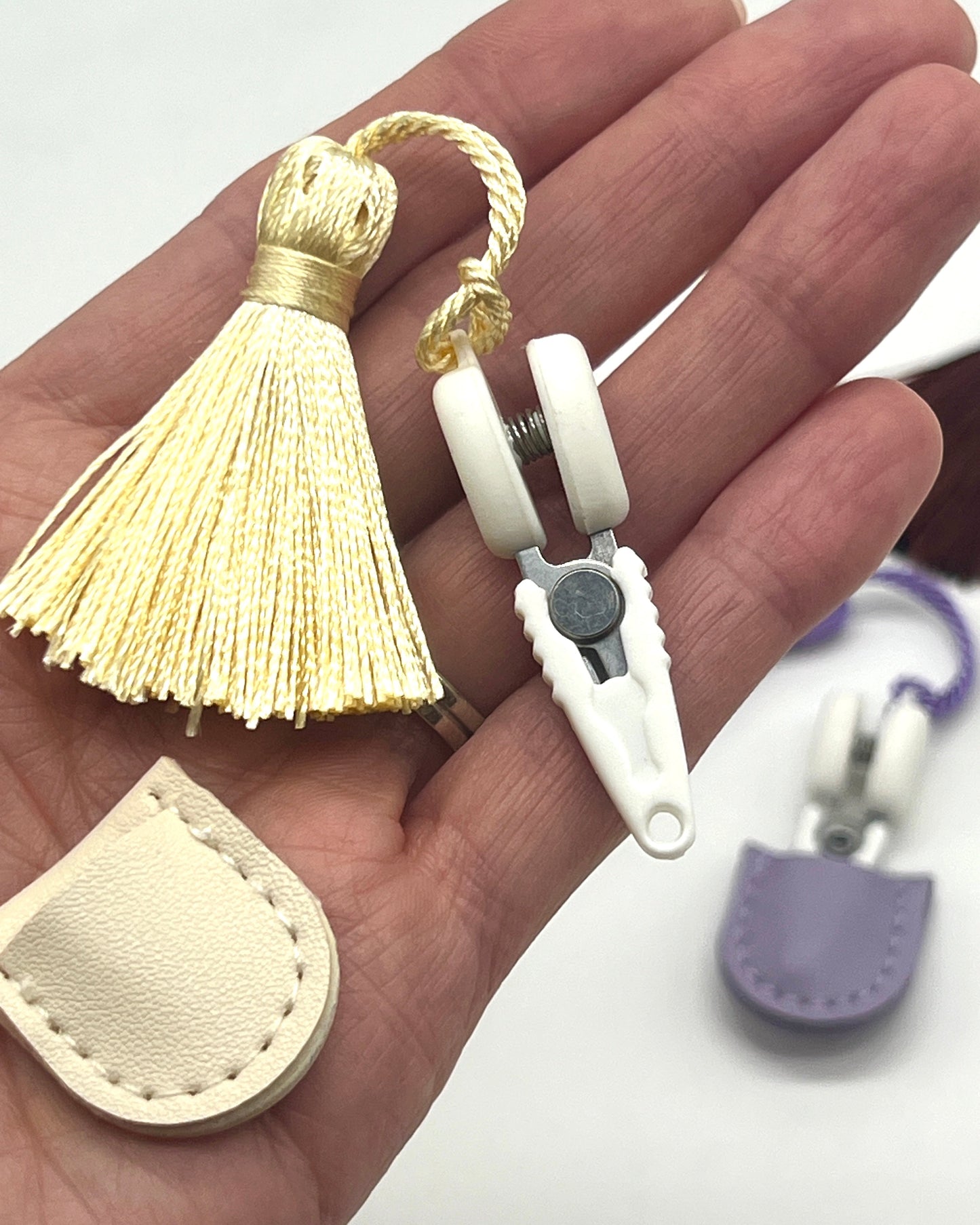 Professional iDOKNiT mini precision thread scissors for crafters. These 42mm spring-style snips feature a decorative tassel and protective cover, designed for sharp, precise trimming of yarn and embroidery floss. Compact and travel-ready accessory curated by iDOKNiT for knitting, crochet, and sewing project bags.