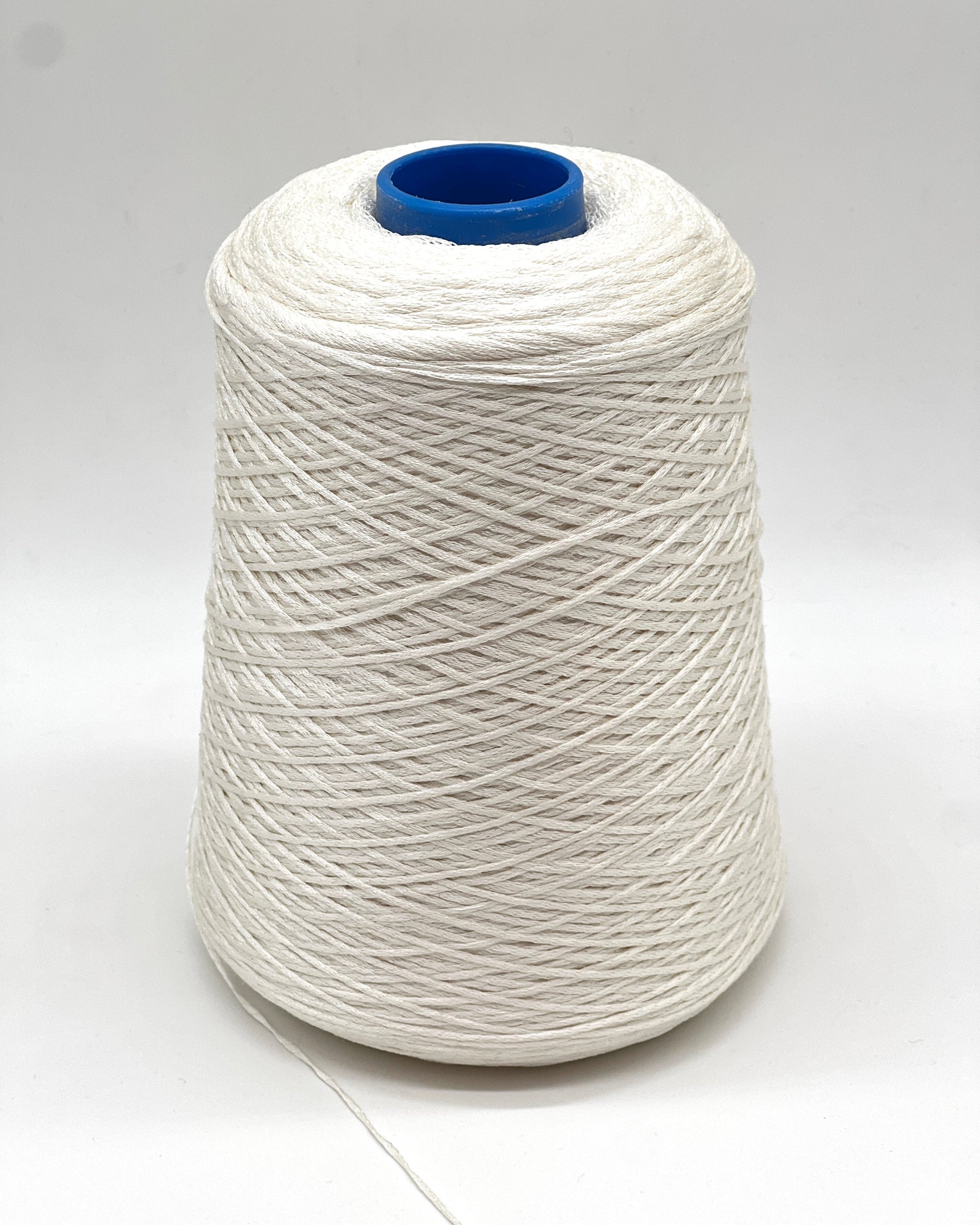 Luxury iDOKNiT fingering weight yarn, SETA SHAPPE by RiGo Italy. 100% Seta Shappe Silk featuring a sophisticated chainette structure for superior breathability and drape, 420m/100g. Authentic Italian-made silk on cones, color 2153 White, curated by iDOKNiT for elite hand and machine knitting projects.