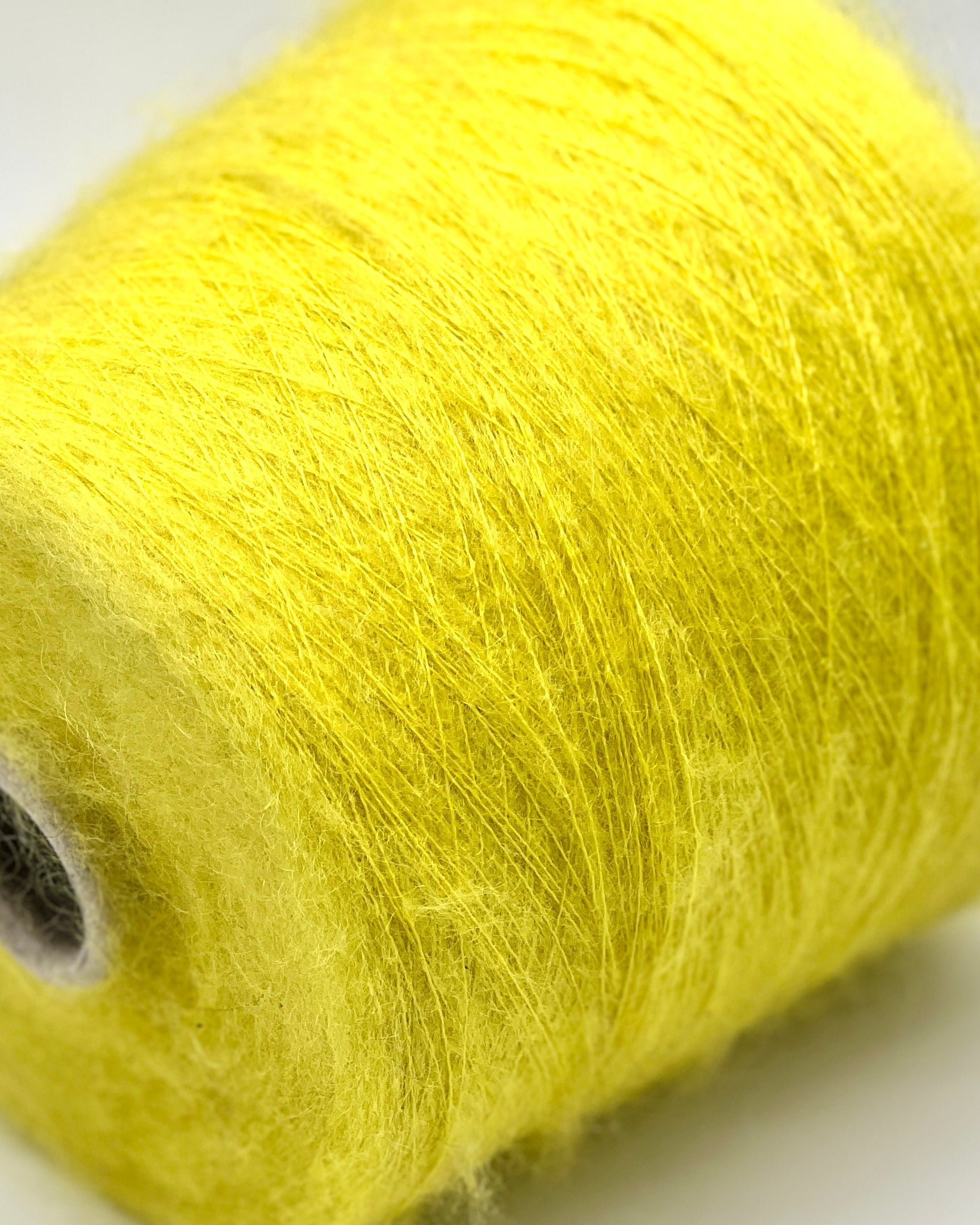 Elite iDOKNiT lace weight yarn, Superkid Mohair blend by Lineapiu Italia. Luxury composition of 58% superkid mohair and 8% wool, Nm 10, providing 1000m per 100g. Authentic Italian-made extra fine yarn curated by iDOKNiT for delicate, airy garments with a signature mohair halo.