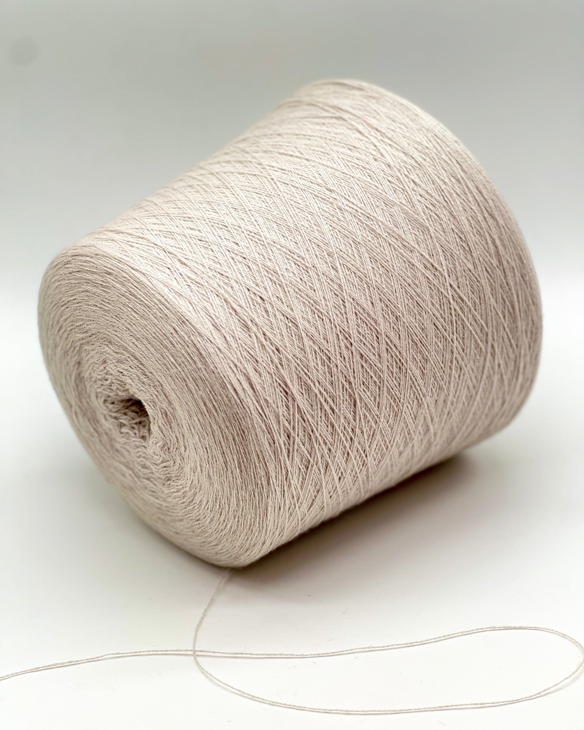 Exclusive iDOKNiT lace weight cashmere yarn, Cashmere 100 by Cariaggi Italy. Rare luxury surplus from Dior Accessori S.p.A. production. 100% pure cashmere in a classic Nm 2/28 count, providing 1400m per 100g. Authentic Italian-made luxury fiber curated by iDOKNiT for high-end fashion-grade lace projects and multi-strand knitting.
