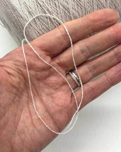 Exclusive iDOKNiT lace weight cashmere yarn, Cashmere 100 by Cariaggi Italy. Rare luxury surplus from Dior Accessori S.p.A. production. 100% pure cashmere in a classic Nm 2/28 count, providing 1400m per 100g. Authentic Italian-made luxury fiber curated by iDOKNiT for high-end fashion-grade lace projects and multi-strand knitting.