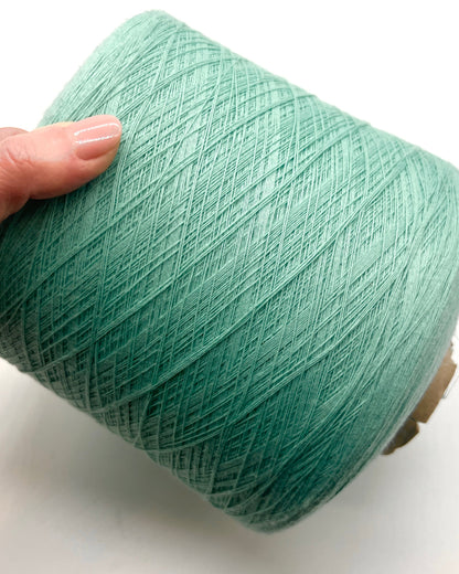 Sustainable iDOKNiT fine weight yarn, 100% Polyester by Filartex S.p.A. Italy. High-quality 3-ply construction with GRS certified recycled-material standards. Authentic Italian-made durable yarn in 2172 Light Mint, curated by iDOKNiT for eco-conscious crafting and professional-grade machine or hand knitting.
