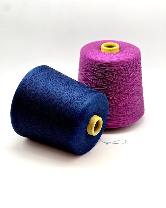 Emilcotoni Silk & Cotton lace yarn from Italy. Shown on professional cones in shades like Ochre, Navy Blue, and Brown. High-quality designer yarn for retail at iDOKNiT.com.