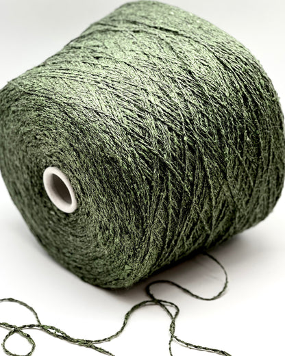Green skein of yarn on a white background