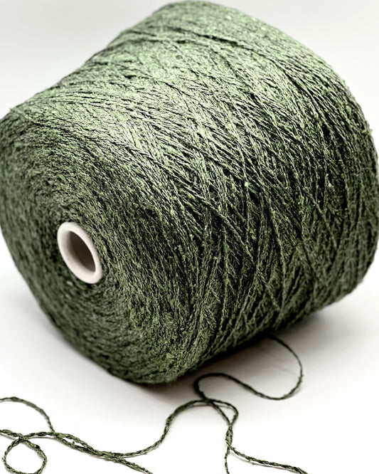 Green skein of yarn on a white background