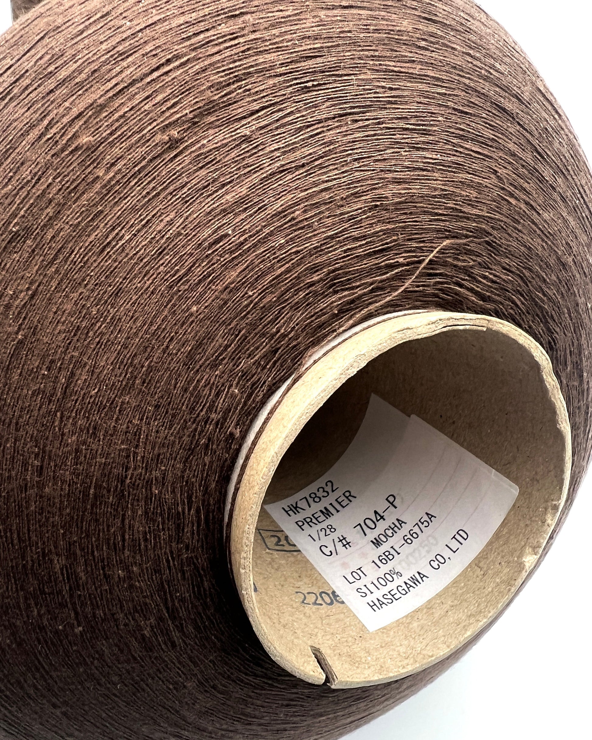Luxury Japanese matte silk yarn Hasegawa PREMIER on cone
Hasegawa PREMIER textured silk yarn with matte artisan texture
Rare Japanese spun silk yarn in mocha color close up
Luxury matte silk yarn for weaving knitting and couture textiles
Ultra fine Japanese silk companion yarn with organic texture