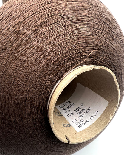 Luxury Japanese matte silk yarn Hasegawa PREMIER on cone
Hasegawa PREMIER textured silk yarn with matte artisan texture
Rare Japanese spun silk yarn in mocha color close up
Luxury matte silk yarn for weaving knitting and couture textiles
Ultra fine Japanese silk companion yarn with organic texture