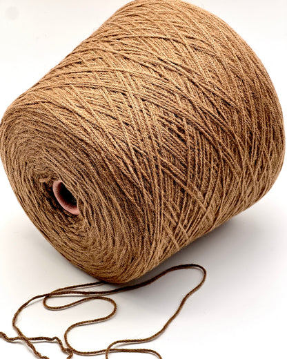 Brown yarn spool on a white background