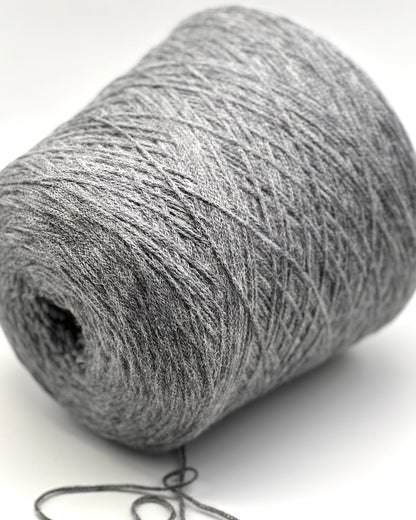Close-up of a gray skein of yarn on a white background