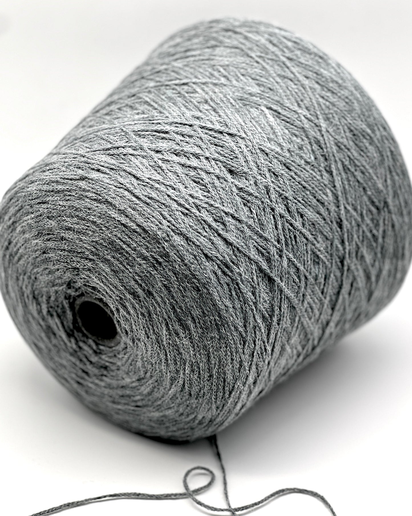 Gray skein of yarn on a white background