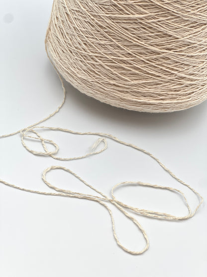 Cone of COTTON FLAME Italian flammé cotton yarn in natural cream color, premium sport weight cotton yarn for sweaters, cardigans, tops, and summer knitwear.
