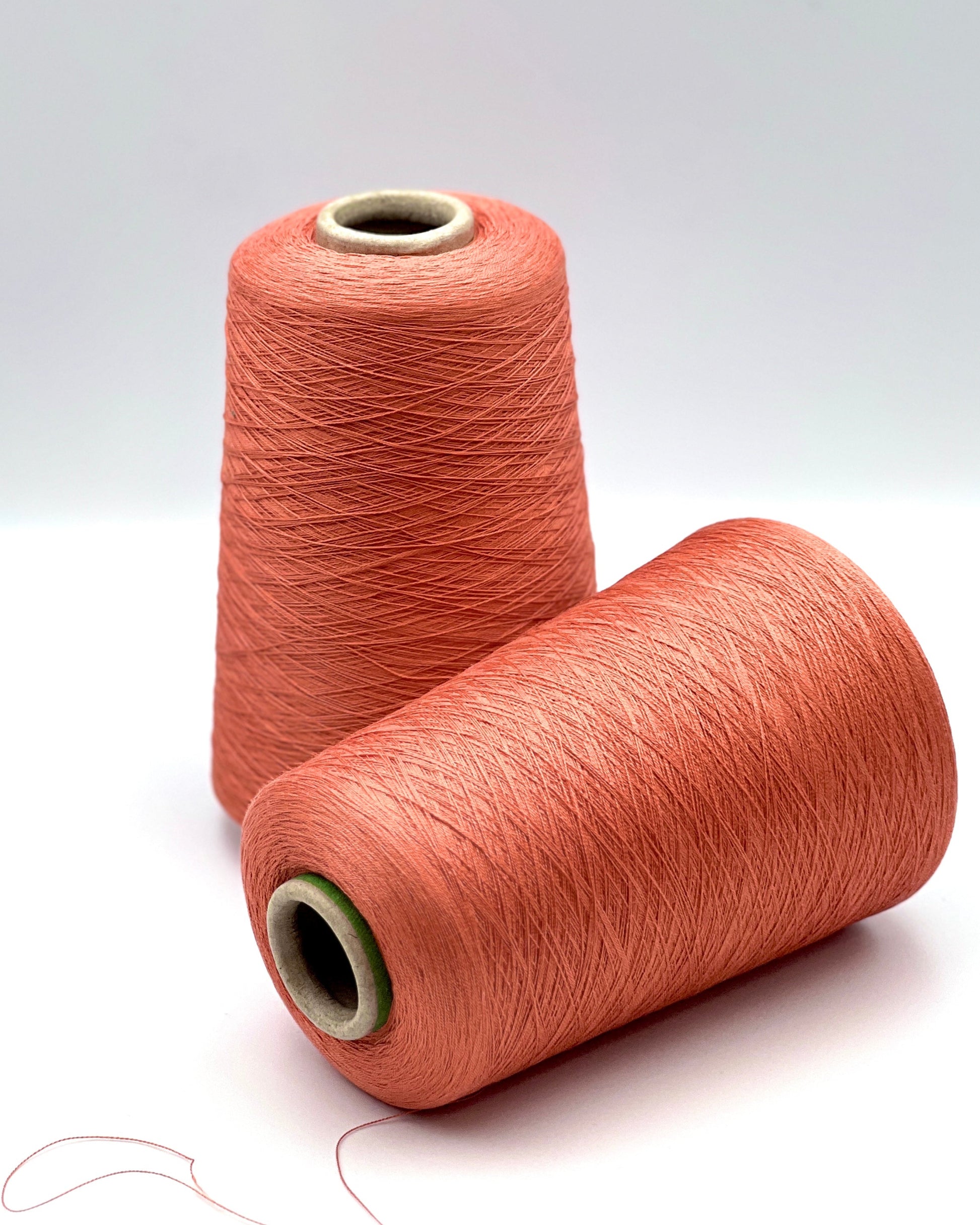 Servizi e Seta VISCOSETTE mulberry silk viscose lace-weight cone yarn in coral color with smooth texture, soft sheen, and elegant drape