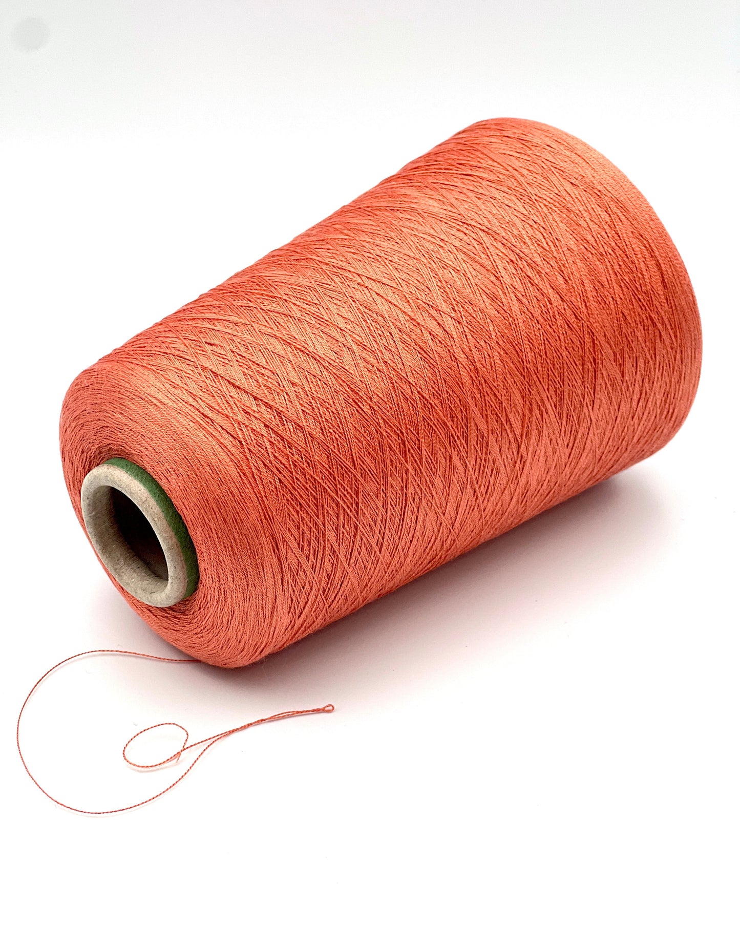 Servizi e Seta VISCOSETTE mulberry silk viscose lace-weight cone yarn in coral color with smooth texture, soft sheen, and elegant drape