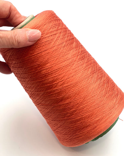 Servizi e Seta VISCOSETTE mulberry silk viscose lace-weight cone yarn in coral color with smooth texture, soft sheen, and elegant drape