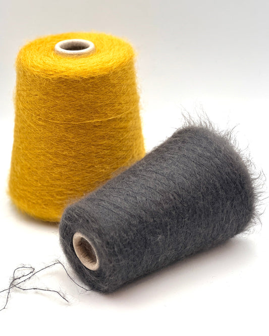 Exclusive iDOKNiT extra fine lace weight yarn, AURORA 100 by Ilaria Italy. A luxury cloud-like brushed mohair blend of 67% superkid mohair, 30% polyamide, and 3% extra fine merino wool providing 1000m per 100g. Authentic Italian-made premium fiber curated by iDOKNiT for airy standalone knitting, delicate lace shawls, and rich multi-strand garment blending.