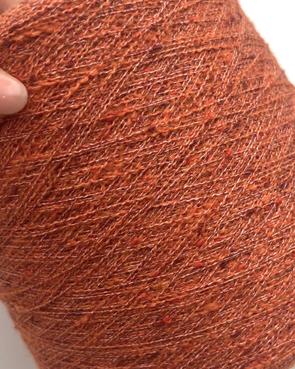 Exclusive iDOKNiT extra fine lace weight yarn, TORRONCINO by Pecci Filati Italy. A luxury fashion tweed yarn blend of 10% cashmere, 48% cotton, 20% merino wool, and 22% polyamide providing 700m per 100g. Authentic Italian-made premium fiber curated by iDOKNiT for lightweight standalone knitting, fine gauge machine knitting, and carrying with companion bases.