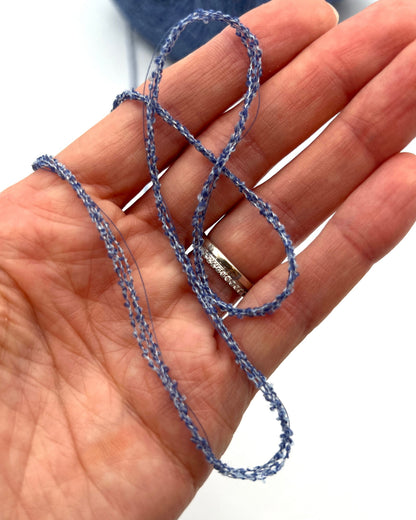 G&G Filati FRIZZ luxury 50% merino wool and 50% silk blend Italian sport weight fantasy boucle yarn in Midnight Blue with integrated 2mm transparent paillettes sequins for runway-ready fashion knitwear at iDOKNiT.