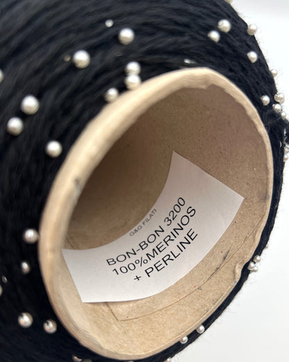 G&G Filati BON-BON luxury 100% merino wool single ply sport weight yarn featuring integrated, generously spaced perline pearl beads wound on an industrial cone for high-end boutique knitwear.
