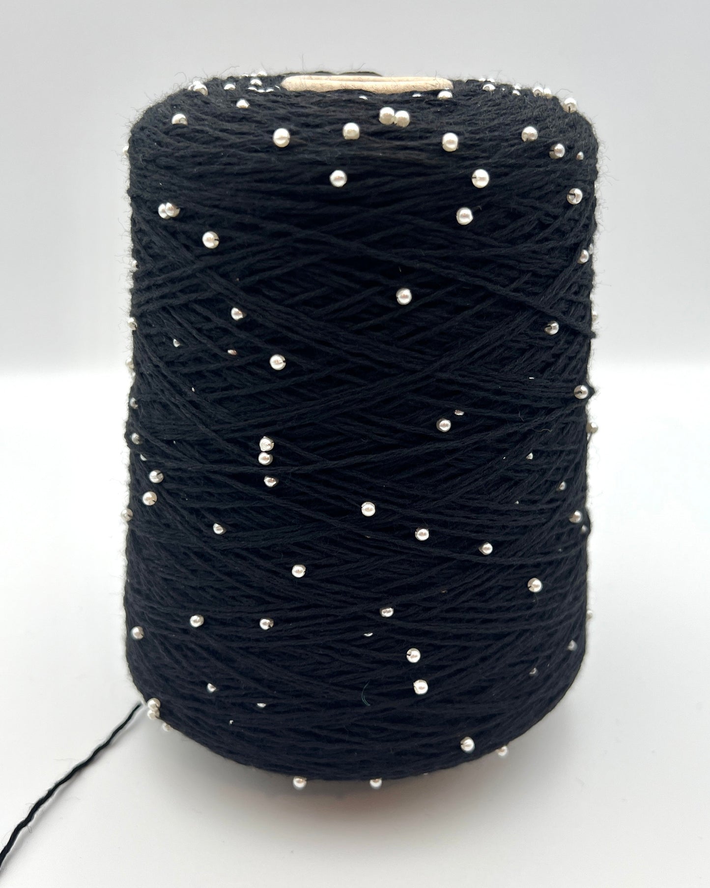 G&G Filati BON-BON luxury 100% merino wool single ply sport weight yarn featuring integrated, generously spaced perline pearl beads wound on an industrial cone for high-end boutique knitwear.