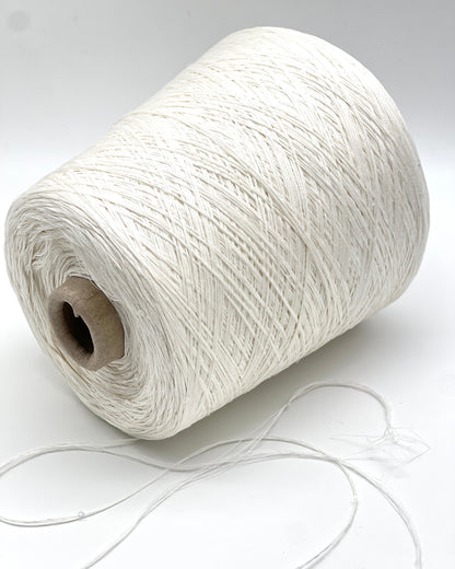Spool of white yarn on a white background