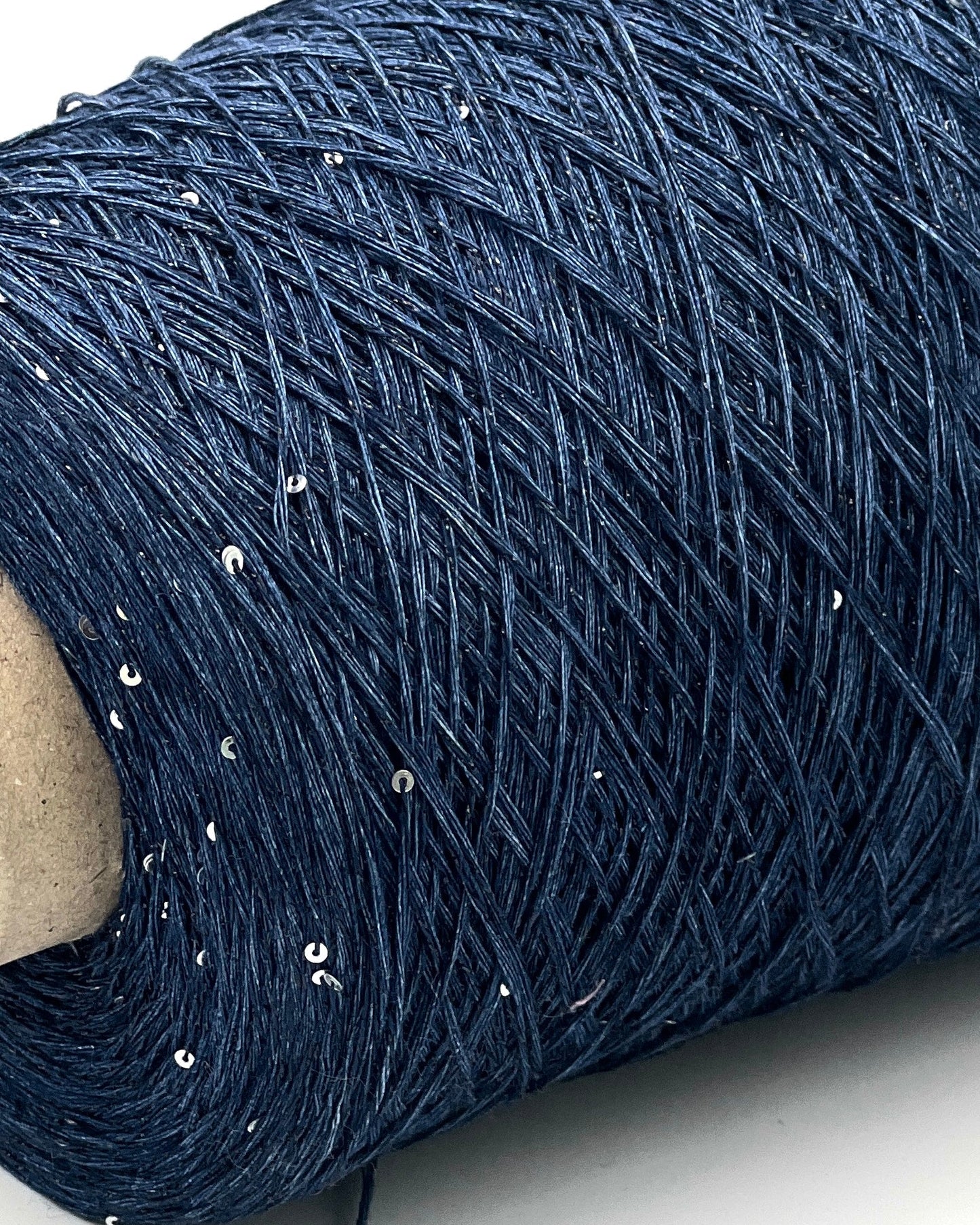 GG FILATI LINO 360 Italian 100 percent linen fingering weight yarn with integrated 1 to 2mm silver paillettes and midnight blue lurex on cone from iDOKNiT