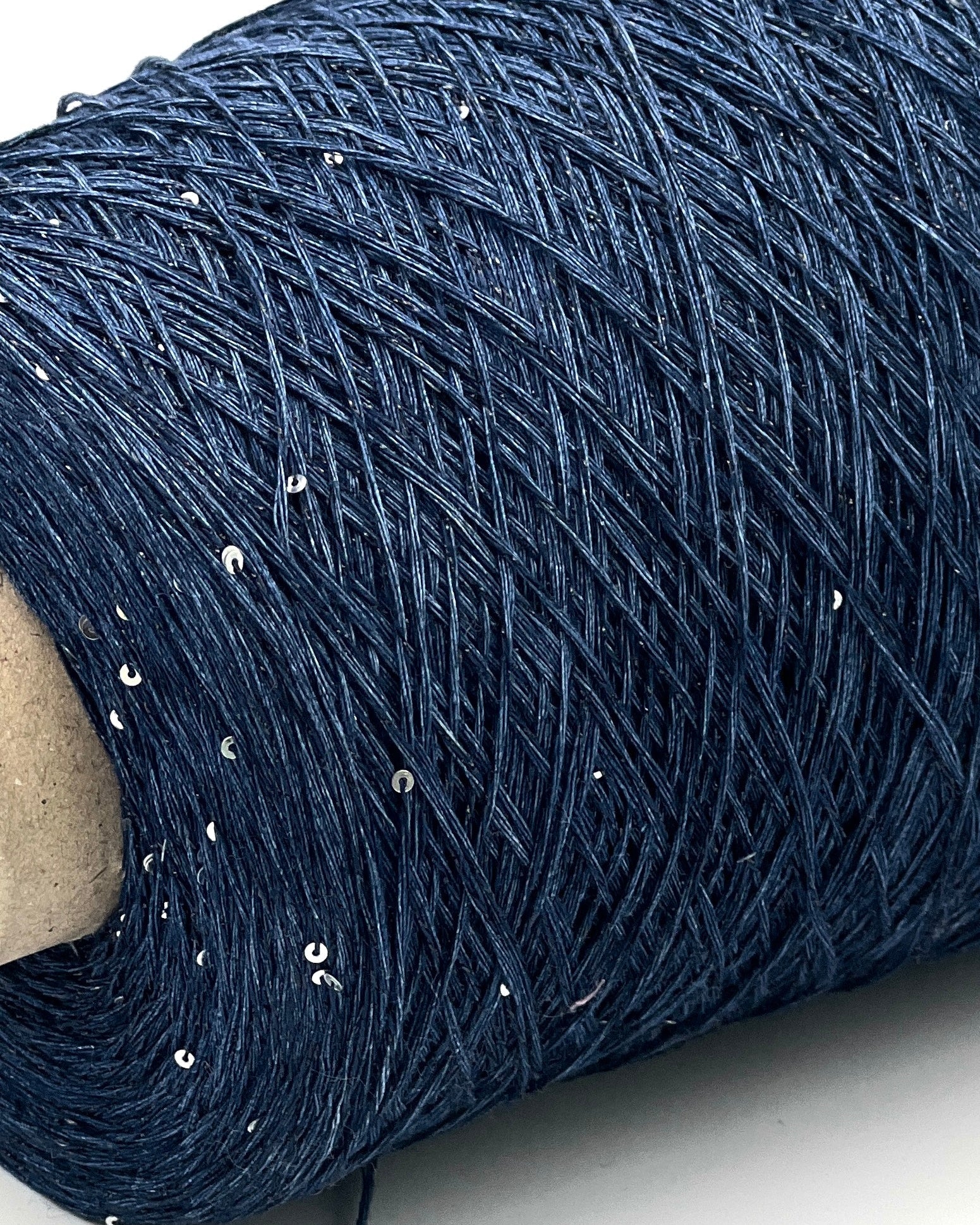 GG FILATI LINO 360 Italian 100 percent linen fingering weight yarn with integrated 1 to 2mm silver paillettes and midnight blue lurex on cone from iDOKNiT