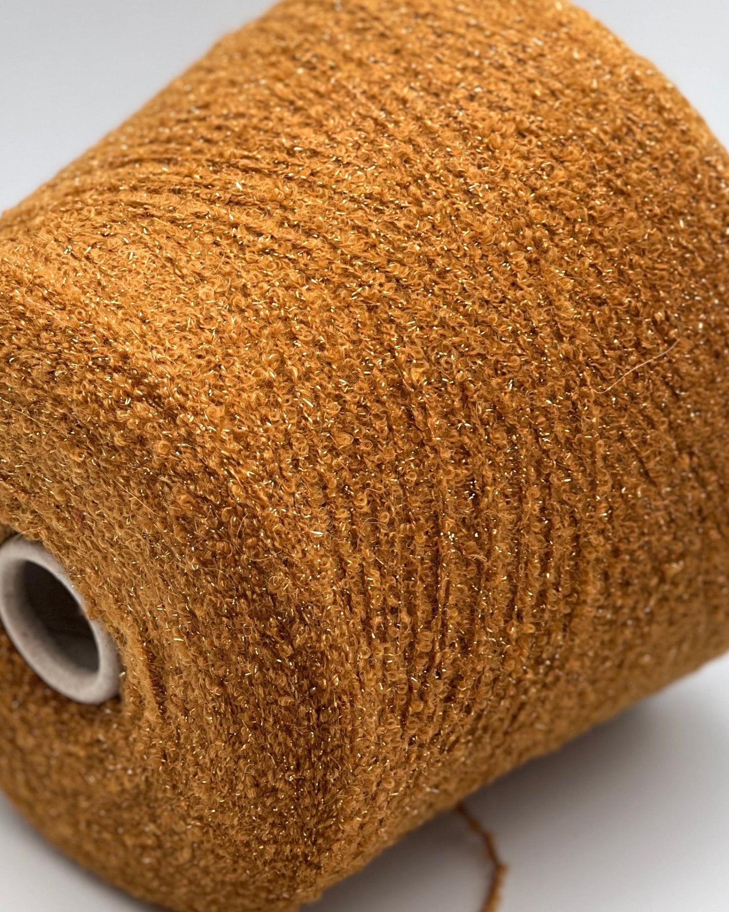 Lanificio Dell Olivo Lumiere Italian alpaca wool boucle fingering weight yarn with integrated metallic lurex on cone from iDOKNiT