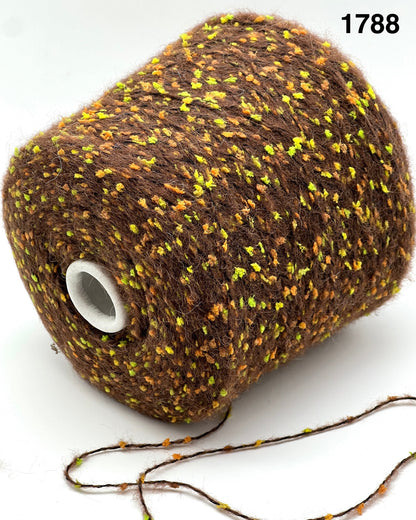 COLOR 1788 CHOCOLATE MULTI - Spool of brown yarn with specks of yellow on a white background
