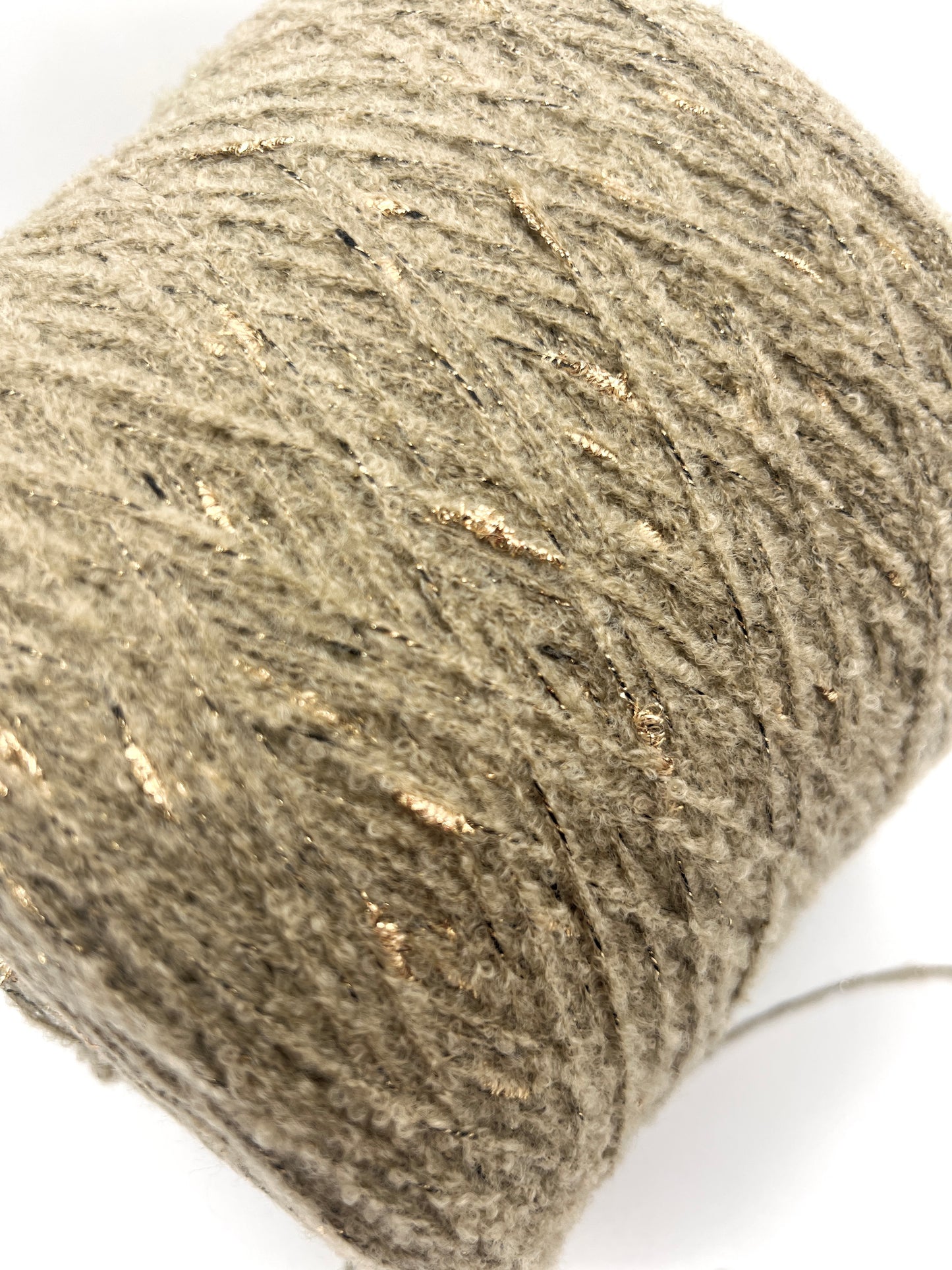 Close-up of a skein of gray yarn on a white background