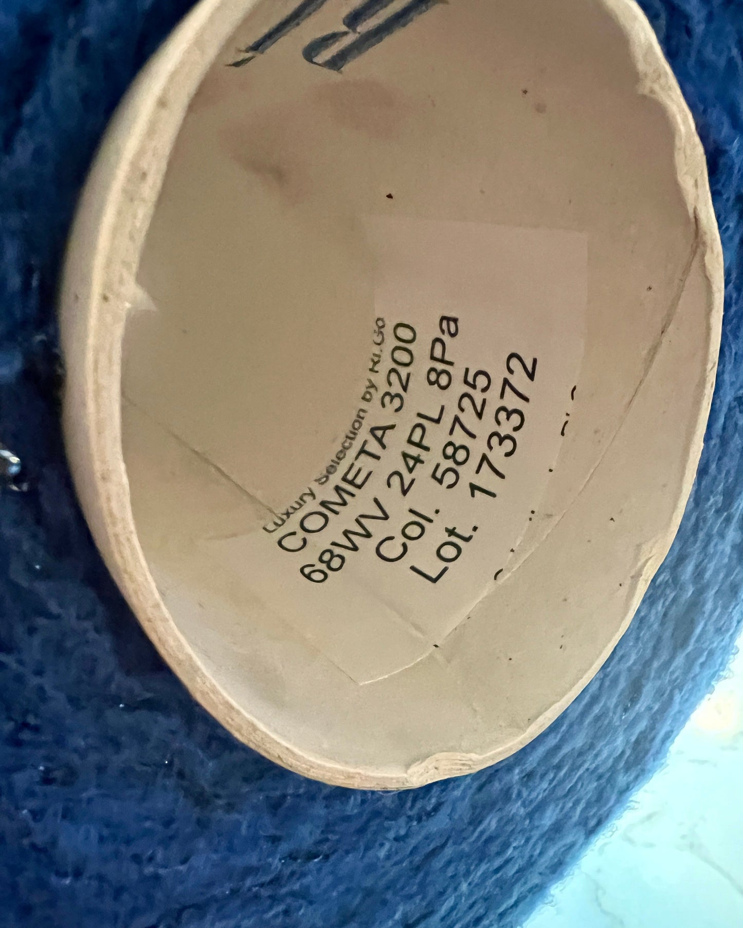 Close-up of a product label with text on a blue background