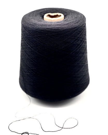 Spool of dark blue thread on a white background