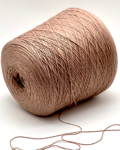 Brown yarn spool on a white background