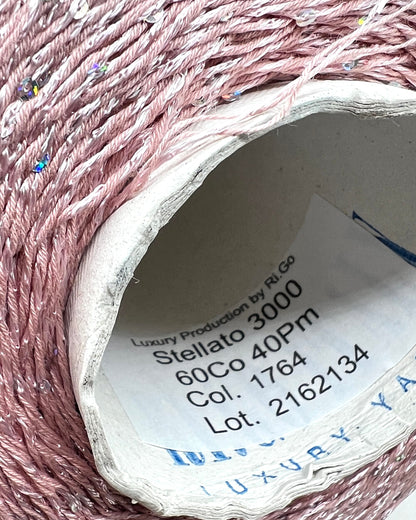 Professional grade RiGo STELLATO sport weight yarn from iDOKNiT, featuring a sophisticated 60% Italian cotton base with 2mm integrated paillettes. This authentic Italian-made yarn is curated by iDOKNiT to provide a refined shimmer and luxury finish for elegant, high-performance knitting projects.
