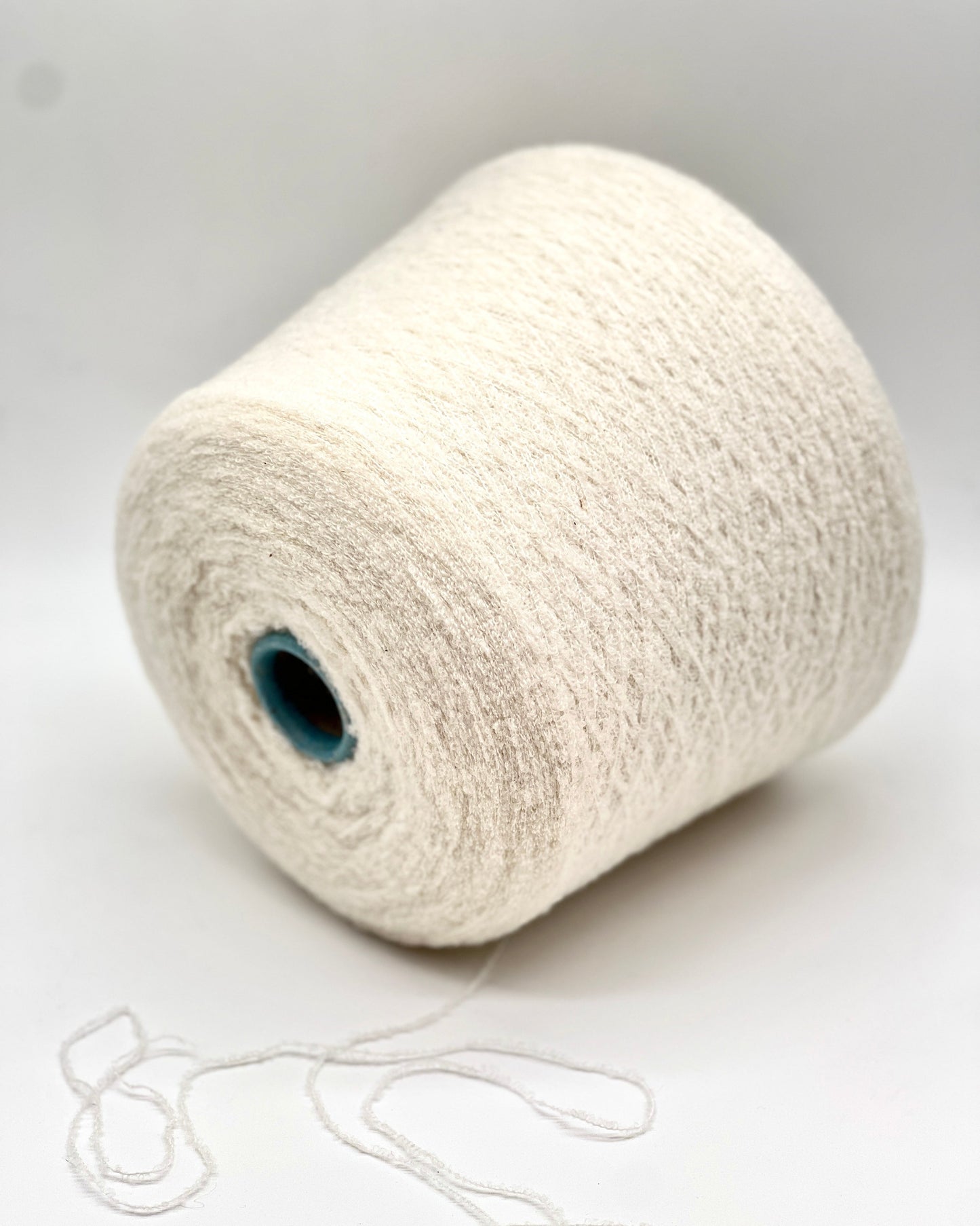 Elite iDOKNiT luxury micro-bouclé yarn, ESTRO by Zegna Baruffa Italy. 78% cashmere lace weight, Nm 9500. Authentic Italian-made soft airy loop yarn curated by iDOKNiT for professional knitting.