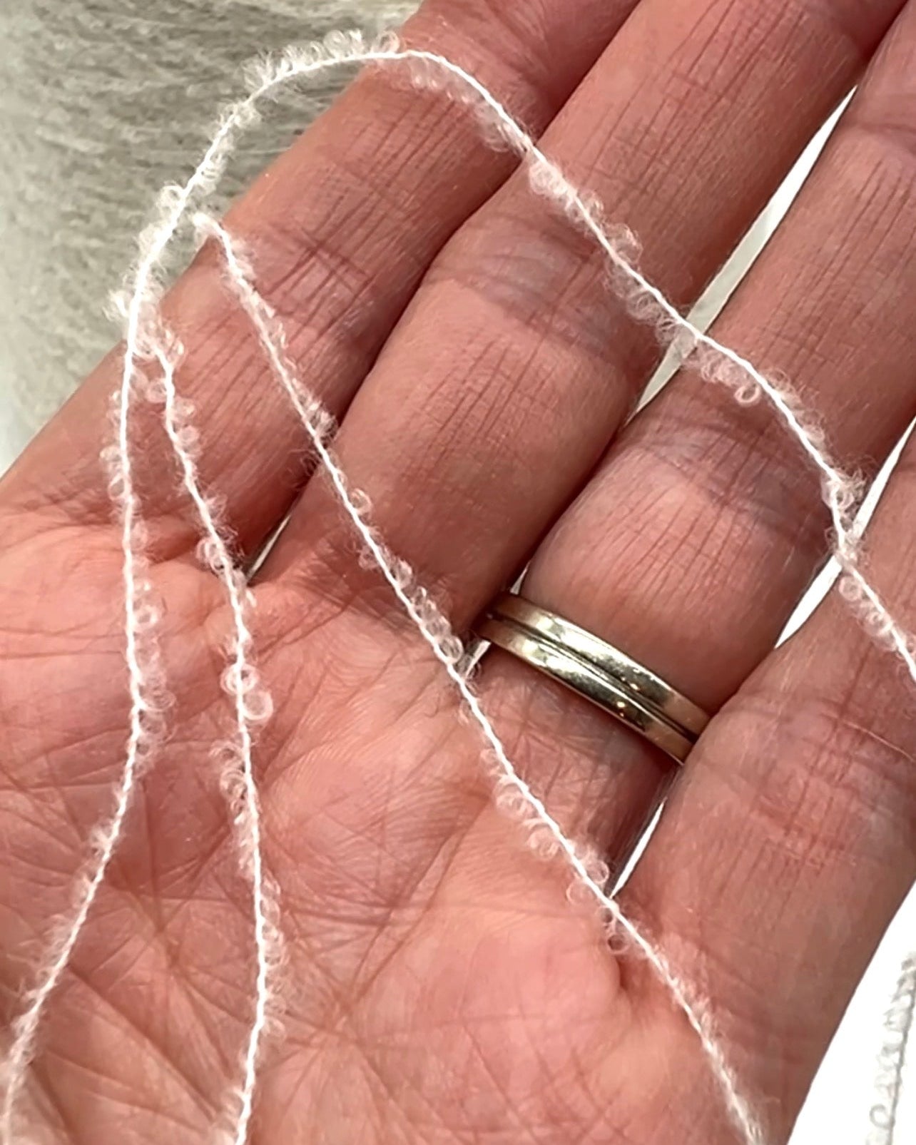 Elite iDOKNiT luxury micro-bouclé yarn, ESTRO by Zegna Baruffa Italy. 78% cashmere lace weight, Nm 9500. Authentic Italian-made soft airy loop yarn curated by iDOKNiT for professional knitting.