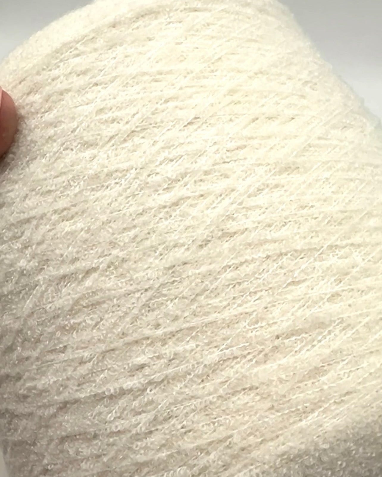 Elite iDOKNiT luxury micro-bouclé yarn, ESTRO by Zegna Baruffa Italy. 78% cashmere lace weight, Nm 9500. Authentic Italian-made soft airy loop yarn curated by iDOKNiT for professional knitting.