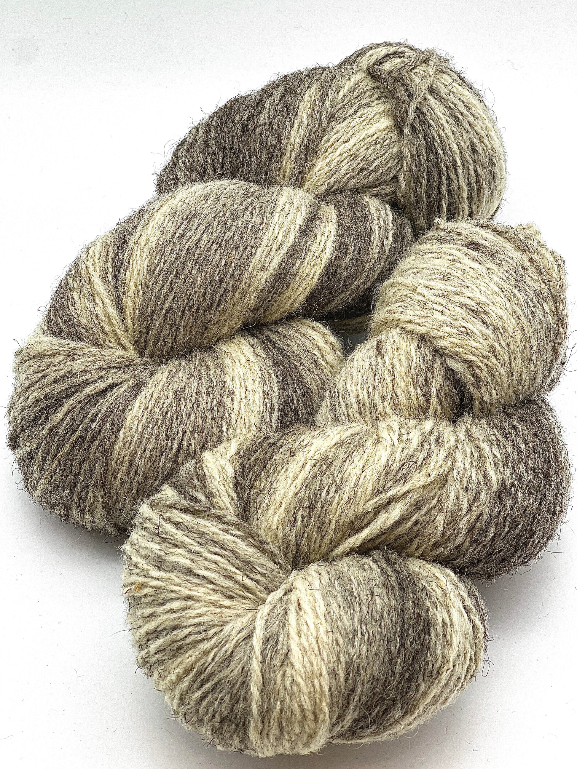 Exclusive iDOKNiT rare heritage yarn, 100% Romanov Sheep Wool 6.2 from Paces Vilnas Fabrika, Latvia. A professionally spun 6/2 two-ply DK weight that offers superior body and stability compared to single-ply versions while retaining 70% natural lanolin. Curated by iDOKNiT in natural grey and tweed-depth dyed shades for high-warmth, weather-resistant heritage sweaters and robust outdoor accessories.