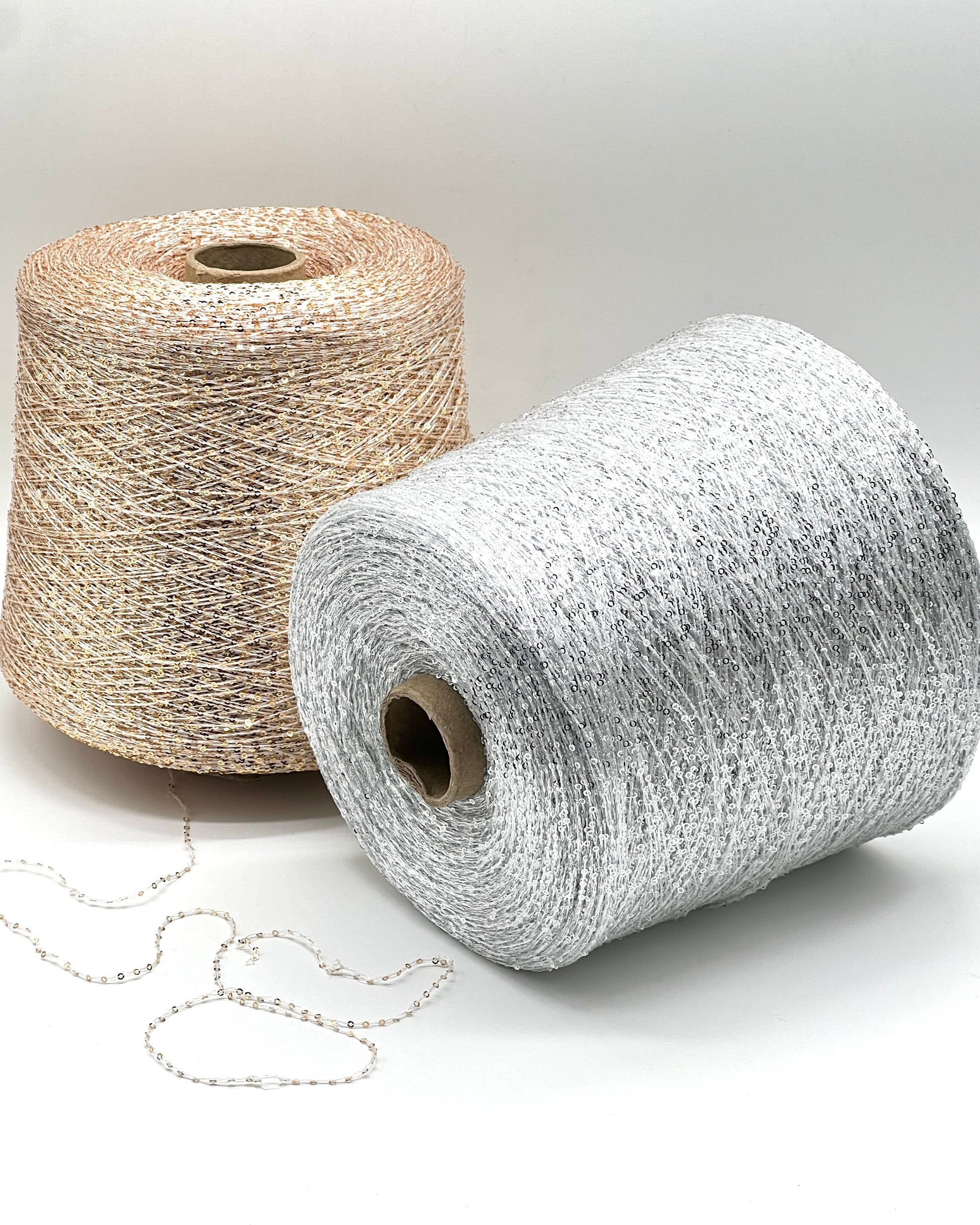 Elite iDOKNiT decorative lace weight yarn, SEQUINS by Cofil Italy. 100% polyester with micro-sequins, 460m/100g. Authentic Italian-made sparkling carry-along yarn curated by iDOKNiT to add texture and shine to professional knitting projects.