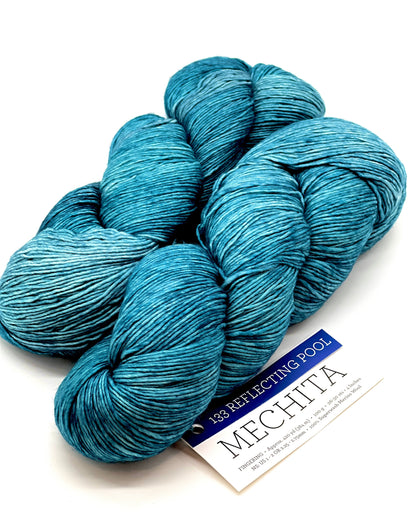 Premium iDOKNiT fingering weight yarn, MECHITA by Malabrigo Peru. 100% superwash merino wool, single-ply construction for elegant drape, 384m/100g. Hand-dyed authentic Peruvian yarn curated by iDOKNiT for soft, vibrant, and professional knitting projects.