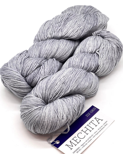 Premium iDOKNiT fingering weight yarn, MECHITA by Malabrigo Peru. 100% superwash merino wool, single-ply construction for elegant drape, 384m/100g. Hand-dyed authentic Peruvian yarn curated by iDOKNiT for soft, vibrant, and professional knitting projects.