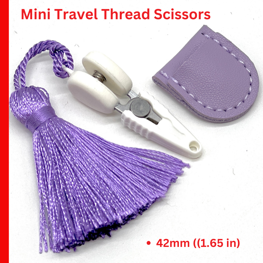 Professional iDOKNiT mini precision thread scissors for crafters. These 42mm spring-style snips feature a decorative tassel and protective cover, designed for sharp, precise trimming of yarn and embroidery floss. Compact and travel-ready accessory curated by iDOKNiT for knitting, crochet, and sewing project bags.
