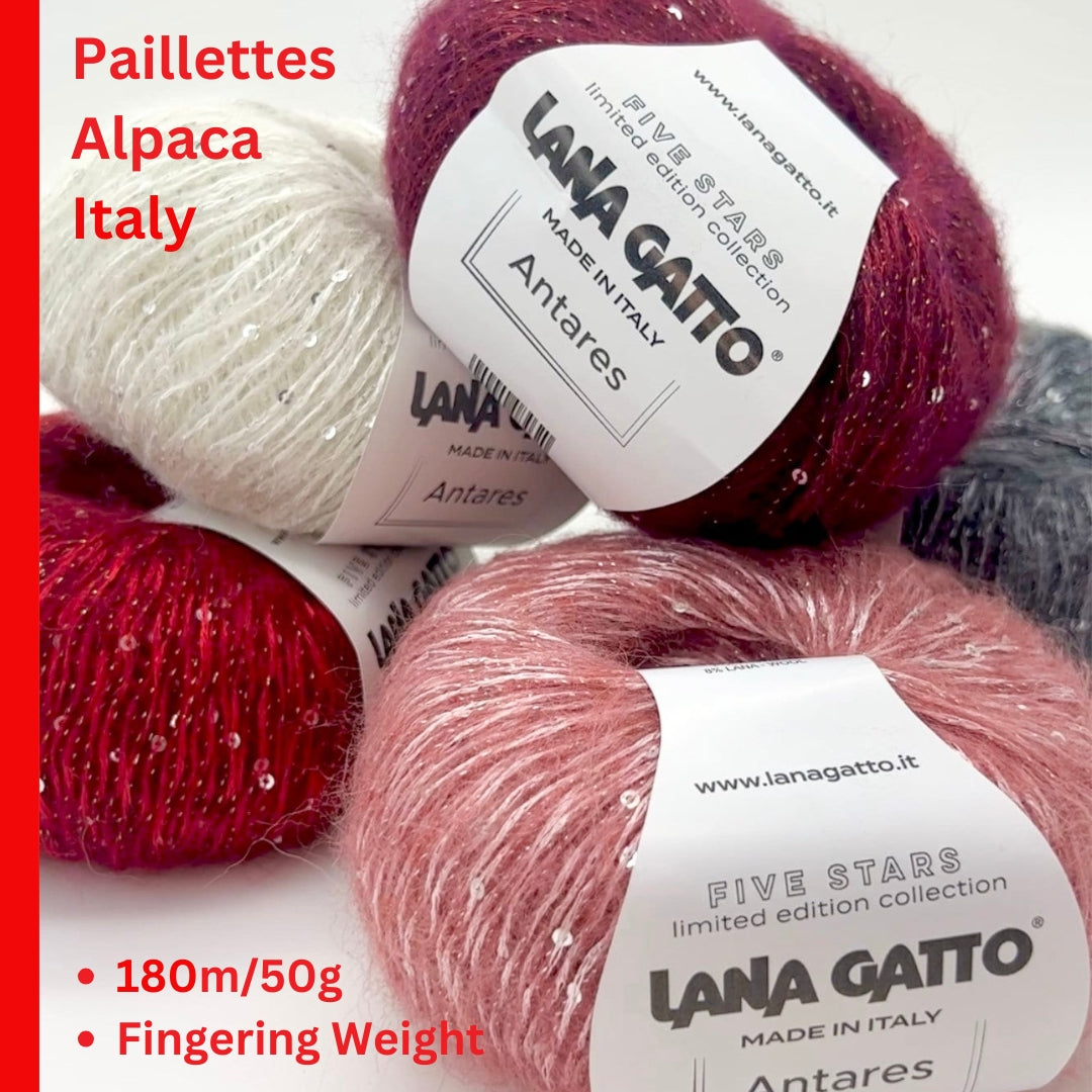 Lana Gatto ANTARES alpaca paillettes yarn soft sparkling Italian fingering yarn
Luxury Italian fingering yarn ANTARES with alpaca halo and refined shimmer
Close up of ANTARES yarn showing sparkle paillettes and soft texture
Alpaca wool paillettes yarn ANTARES for shawls sweaters and accessories
Elegant sparkle yarn ANTARES for festive lightweight knitwear