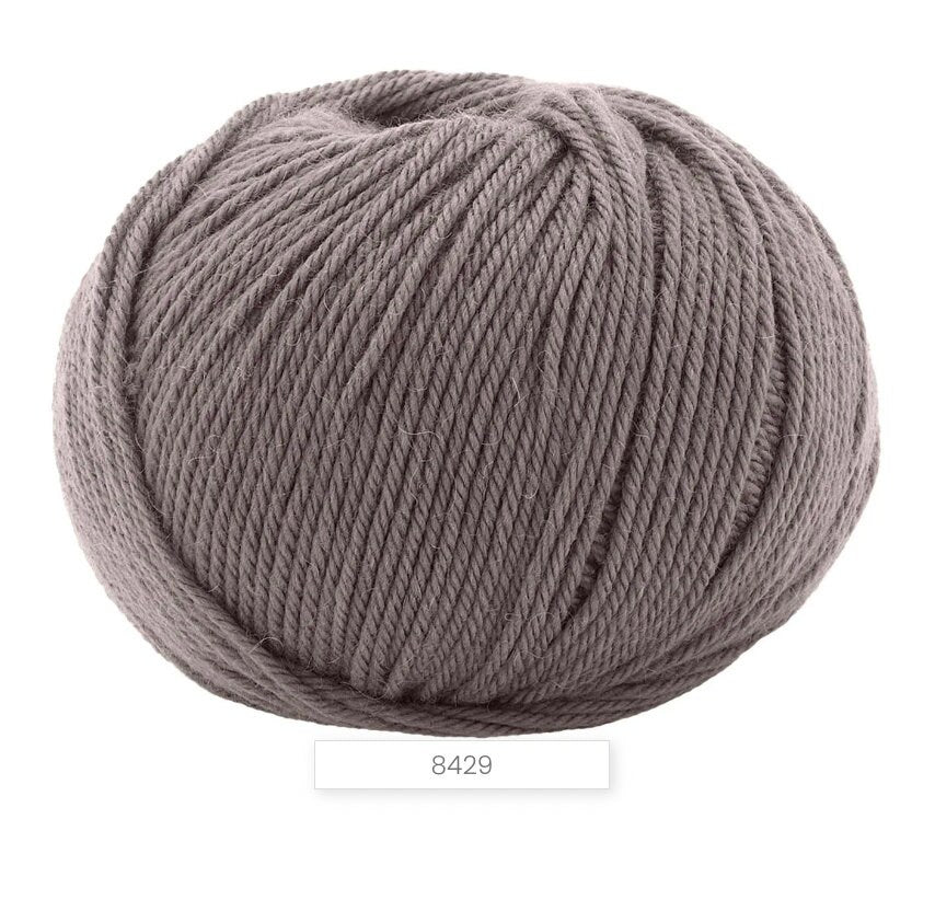Gray skein of yarn on a white background