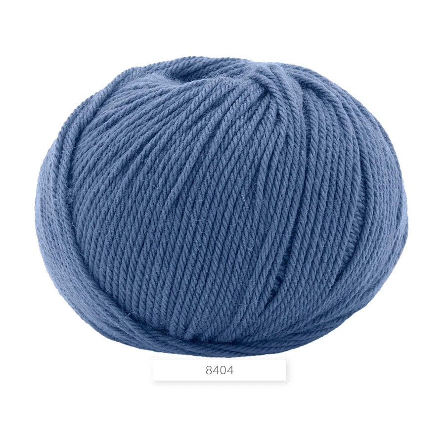 Blue ball of yarn on a white background